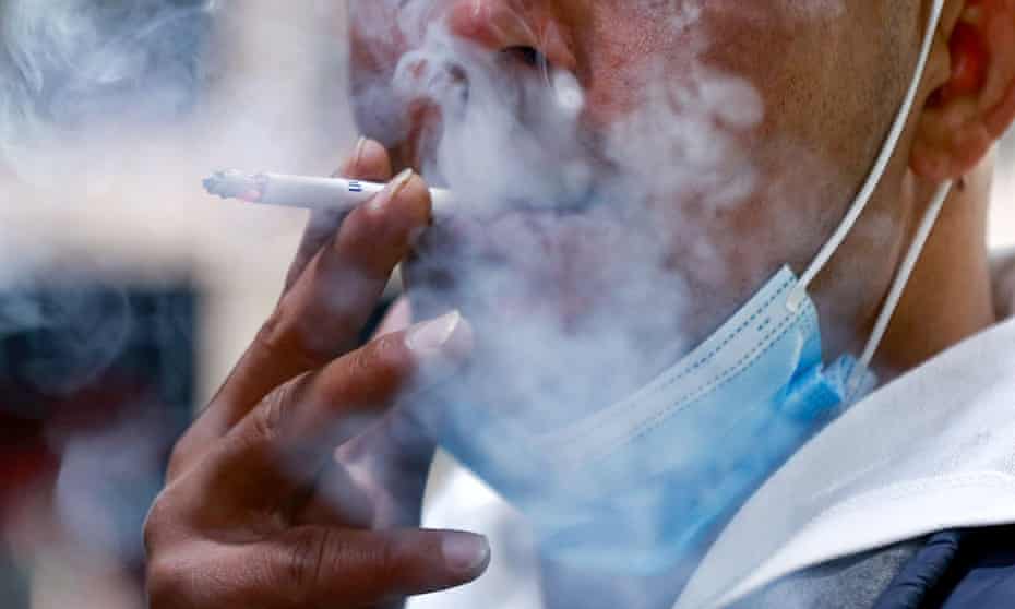 A Jordanian man smokes a cigarette
