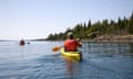 A person kayaks in the middle of Lake Superior in Michigan.