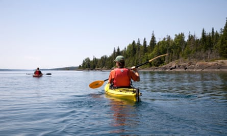 Two people kayaking on a lake