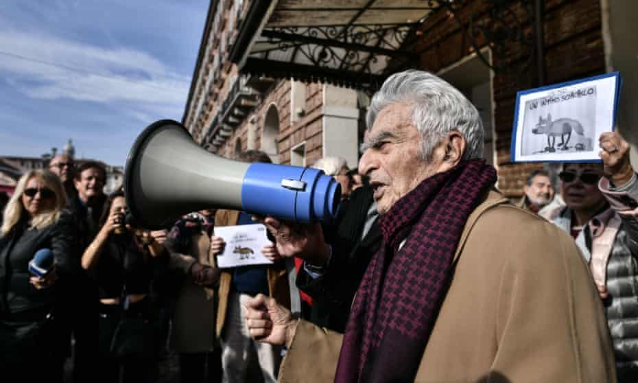 100-years-old Italian journalist, lawyer and politician, Bruno Segre speaks with a megaphone in Turin on Tuesday.
