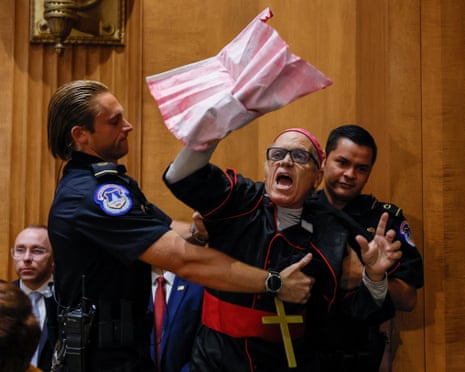 US Capitol police officers detain a protester.