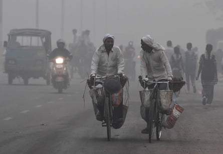 Indian commuters drive amid heavy smog in Delhi on 7 November 2017. The city woke up to a choking blanket of smog that day, as air quality in the world’s most polluted capital city reached hazardous levels.