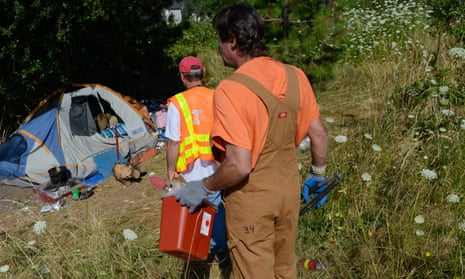 Inmates in Oregon are provided with gloves, tongs and biohazard boxes to protect themselves from exposure to dirty needles and other hazards while cleaning up homeless camps.