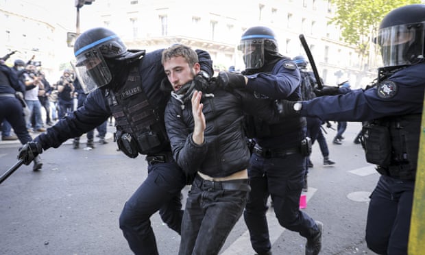 French police detain a protester in Paris.