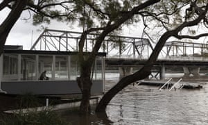 The swollen Shoalhaven river in Nowra on Monday. Heavy rain has caused flash flooding on the NSW south coast, and the body of a kayaker was found in a swollen river in the ACT on Sunday.