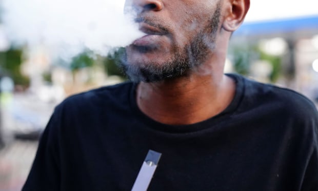 A man uses a Juul vaporizer in Atlanta.