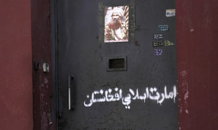 Arabic graffiti reading ‘Afghanistan Islamic Emirate’ on the main door of the Afghanistan National Institute of Music in Kabul.
