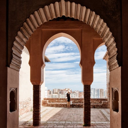 A view through an ornate window in the Alcazaba moorish fortress, Malaga, Spain.