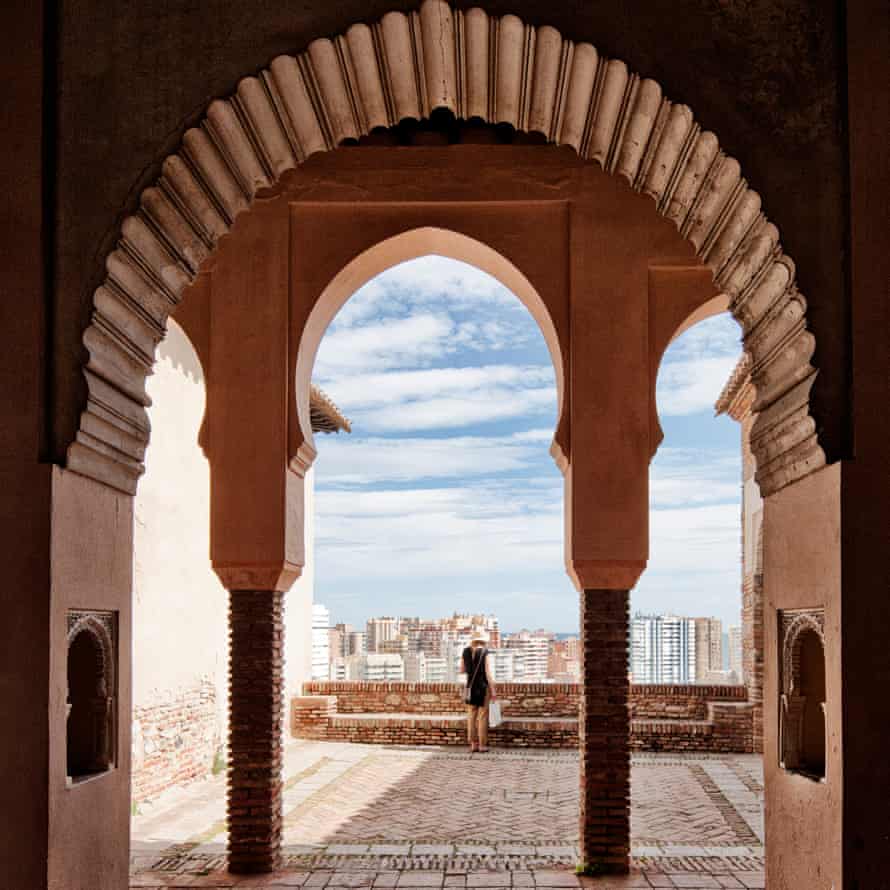 A view through an ornate window in the Moorish fortress of Alcazaba, Malaga, Spain.