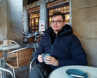 Robin Craig sitting outside at a restaurant, holding a drink