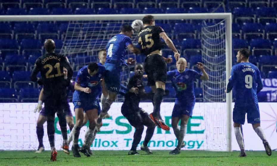 Craig Dawson (No 15) rises highest to send a fine header into the Stockport County net and send West Ham through to the fourth round of the FA Cup.