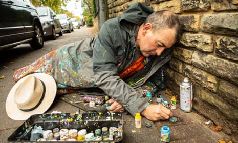 Ben Wilson working on gum stuck to a pavement in Muswell Hill, north London. 
