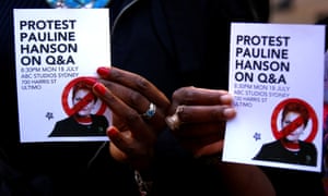 Protesters show pamphlets about Pauline Hanson during a rally to show support for the Black Lives Matter movement in Sydney on 16 July.