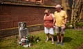 An older couple stand next to a baby memorial at a church