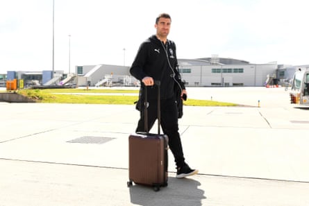 Sokratis boards the team flight at Luton airport on Saturday.