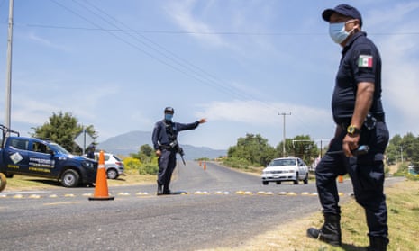 Community police members control vehicles in Michoacán state, Mexico on 11 April 2020. As authorities focus on pandemic control, analysts fear criminal groups will shift power from the state.