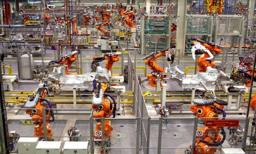 Robots ready to produce the new Mini Cooper at BMW’s plant at Cowley in Oxford.
