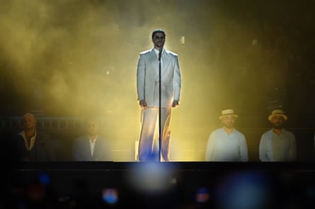 Bad Bunny performing in white suit