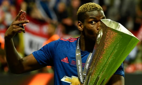 Manchester United’s Paul Pogba celebrates with the trophy