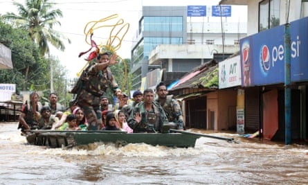 Soldiers evacuate local residents in Ernakulam.