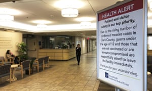 A sign prohibiting all children under 12 and unvaccinated adults at the entrance to the PeaceHealth Southwest Medical Center in Vancouver, Washington.