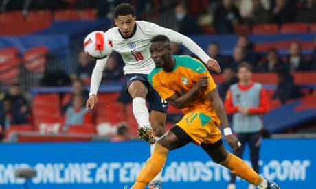 England’s Jude Bellingham shoots while Eric Bailly tries to block