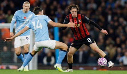 Manchester City’s Nico González tries to take possession from Alex Scott of Bournemouth