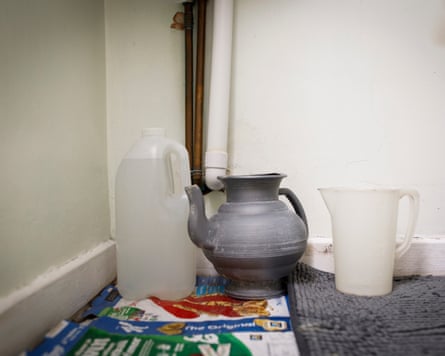 Plastic water containers on the floor