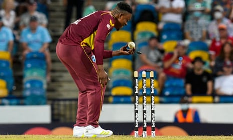 Sheldon Cottrell of West Indies takes the wicket of Adil Rashid of England.