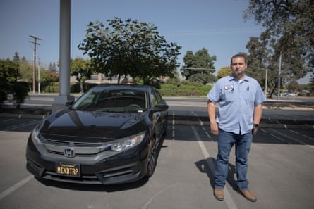 man next to car