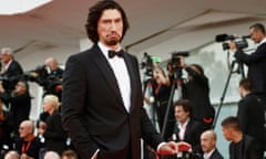 Adam Driver pulls a long face on the red carpet for the premiere of Ferrari at the 2023 Venice Film Festival