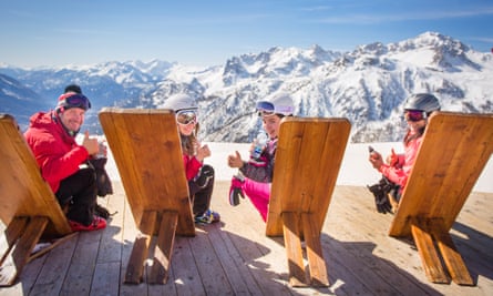 Family enjoying view at Serre Chevalier ski resort, France