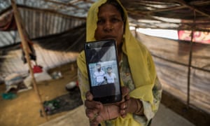Nur Asha with a photograph of the sons she lost in Myanmar.