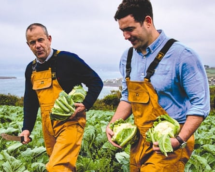 David Simmons pictured with his son Tom harvesting cauliflowers.