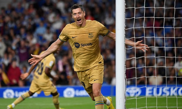 Robert Lewandowski celebrates scoring Barcelona’s third goal and his second against Real Sociedad.