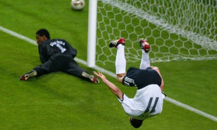 Miroslav Klose leaps for joy after scoring against Saudi Arabia in 2002.