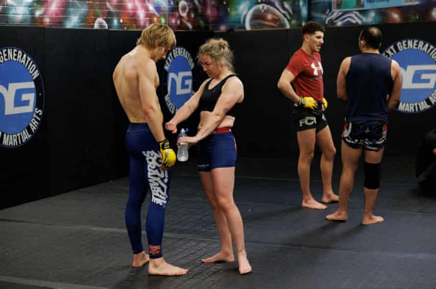 The two fighters compare bodies during a training session.