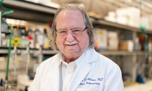 jim allison smiling for the camera in a laboratory