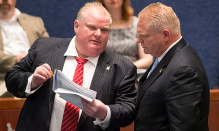 Doug Ford with his brother Rob Ford, left, the late Toronto mayor who was notorious for smoking crack while in office, in November 2013.