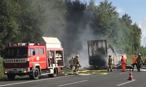 Several fire engines and ambulances are at the scene.