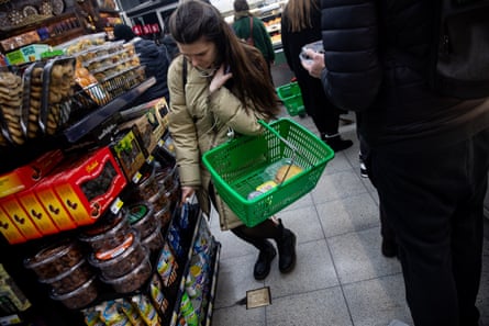 a female leans down to prime an point disconnected a shelf