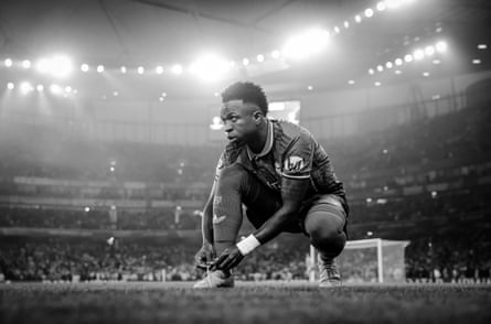 Vinícius Júnior ties up his boots just before kick-off at the Champions League quarter-final, first leg against Arsenal at the Emirates Stadium.