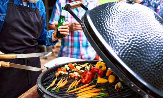 A man grilling vegetables on the barbecue