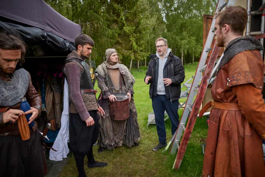 Director Peter Stickney talks to the cast backstage during rehearsals at the Stanley Hall base camp in Essex.