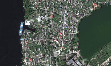 A satellite image shows a view before homes were flooded along Dnipro River southeast of Kherson, Ukraine, 6 June 6, 2023.