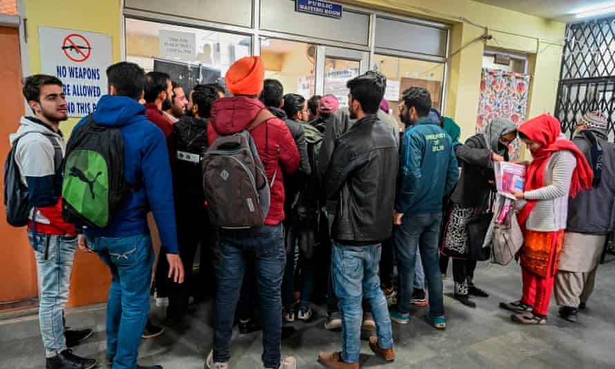 Kashmiri students queue up to use internet facilities at the divisional commissioner’s office in Srinagar