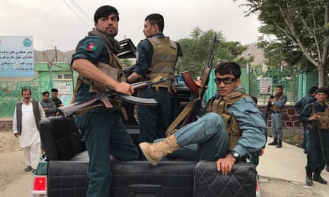 Afghan police officers on the back of a truck