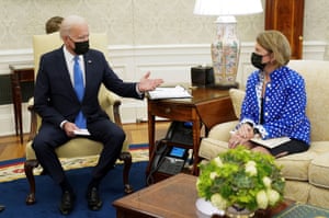 Joe Biden gestures toward Senator Shelley Moore Capito during an infrastructure meeting in the Oval Office.