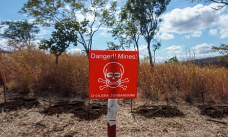 A sign in English and Shona warns of landmines in Rushinga, Zimbabwe.