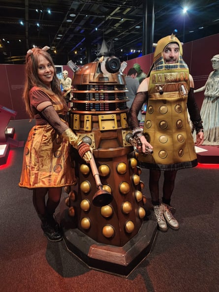 Kate and Tom in fancy dress with a Dalek